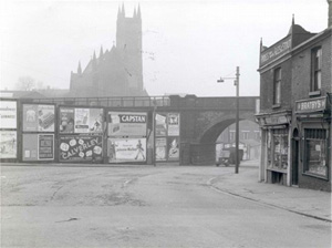 View of Bury New Road facing the viaduct. Parish Church in the background